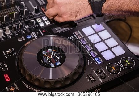 Disc Jockey playing music. Running the mixer table. business party