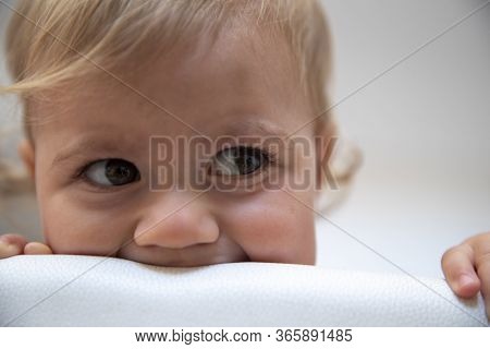 Cute Baby Girl With Blond Hair Close Up With Neautiful Expression