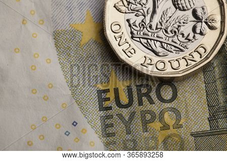 British One Pound Coin And European Note. Exchange Rate Concept