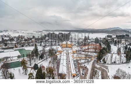 Aerial View Of Schloss Hellbrunn Covered In Snow View Of Snow Mountain Untersberg Near Salzburg Outs