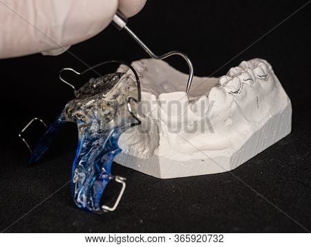 Comparison Of Gimension In Plaster Tooth Plaster Copy With New Orthodontic Removable Retainer.