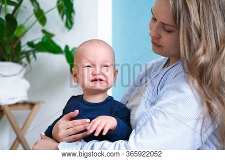 Mom Hugs Crying Moody Kid Tantrum. Little Baby Child On Mother Hands. Family Life, Motherhood