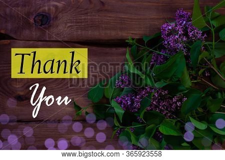 Purple Lilac Flowers With Fresh Green Leaves On Black Background With Selective Focus. Dark And Mood