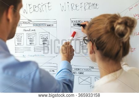 Ui Ux Designers Team Working On New Website Wireframe In Office