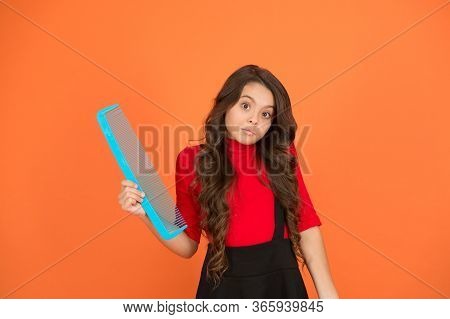 It Can Be Easy To Haircare. Small Girl Hold Comb Brown Background. Haircare Tool. Hair Untangling. B