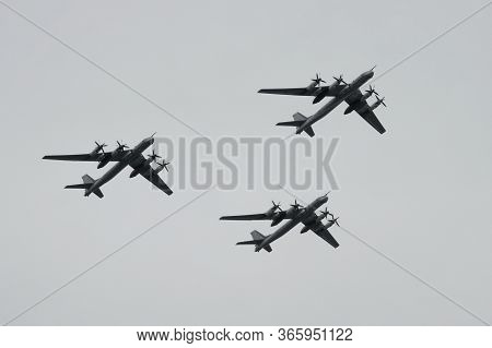 Moscow, Russia - May 9, 2020:a Group Of Turboprop Strategic Bombers Tu-95ms Fly Over Red Square In A