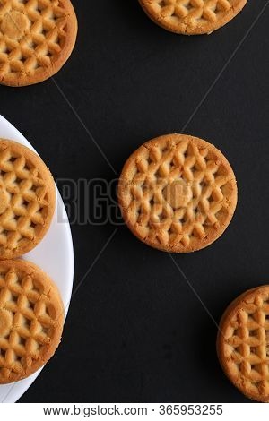 Cookie Close-up On A Plate On A Table. Vertical View From Above
