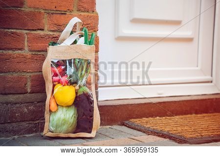 Fresh Organic Vegetable Delivery Concept. Reusable Bio Eco Sackcloth Fabric Bag Packaging Near Brick