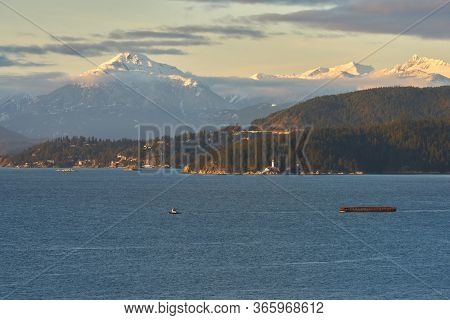 English Bay And Mt Tantalus. English Bay With Historic Point Atkinson Lighthouse And The Tantalus Mo