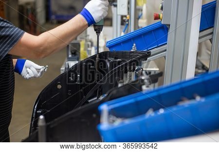 Production Operator Assembling Frontlight Headlamp, Headlight For A Vehicle Or A Car In Automotive I