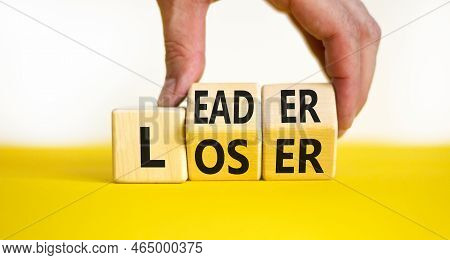 Loser Or Leader Symbol. Concept Words Loser Or Leader On Wooden Cubes. Businessman Hand. Beautiful Y