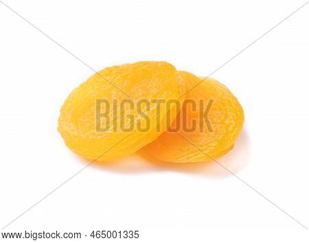 A Pair Of Dried Apricots Isolated Over White Background.