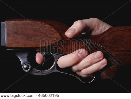Lever-action Hunting Rifle Detail With Finger Squeezing Trigger