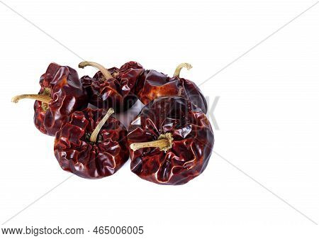 Spanish Dried ñora Nyora Pepper On White Background, Artificial Light, Close Up, Top View