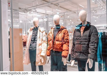Shopping Store. Gdansk, Poland, Europe. Mannequins Dressed In Womens And Mens Winter Warm Clothes In