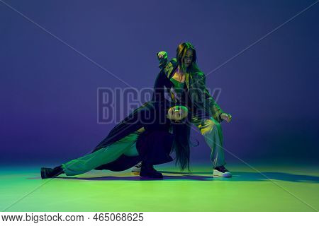 Two Dancers, Stylish Fashionable Dance Couple Dancing Contemporary Dance On Colorful Gradient Blue-g