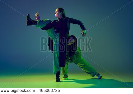 Two Dancers, Stylish Fashionable Dance Couple Dancing Contemporary Dance On Colorful Gradient Blue-g