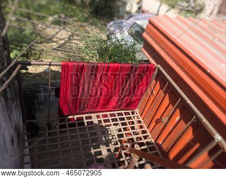 Colourful Blanket Dried On Rusty Balcony In Hyderabad,, India