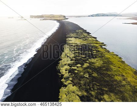 Volcanic Black Sand Beach Reynisfjara, View Of Reynisdrangar In The Distance