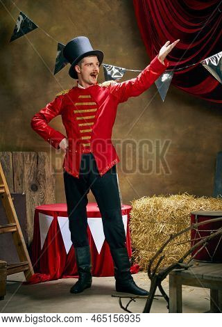 Vintage Portrait Of Male Retro Circus Entertainer Expresses Rejoice And Announces Start Of Show Over