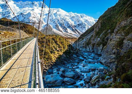 Crossing The Hooker Valley On An Empty Swing Bridge On The Walk Through The Hooker Valley To Views O