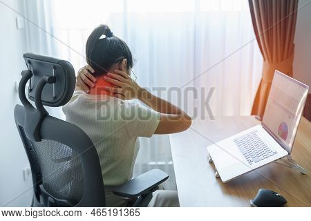Woman Having Neck And Shoulder Pain During Work Long Time On Workplace. Due To Fibromyalgia, Rheumat
