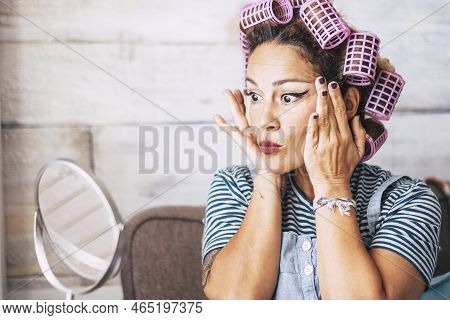 Beautiful And Funny Expression Caucasian Adult Woman Getting Ready At Home In Front Of The Mirror Wi