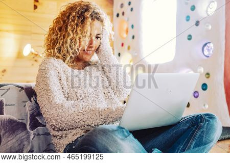 Beautiful Curly Blonde Adult Woman Use Computer Laptop In The Bedroom At Home Or Hotel - Enjoying Fr