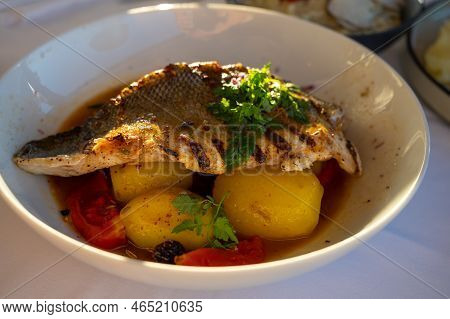 Provence Cuisine, Filet Of Seabass White Fish Served With Potatoes, Tomatoes And .bouillabaisse Jus