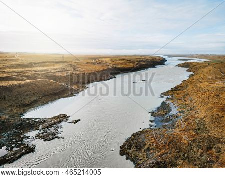 Ice Blue Glacier River In Iceland Frome Above