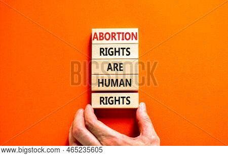 Abortion Rights Symbol. Concept Words Abortion Rights Are Human Rights On Wooden Blocks. Businessman