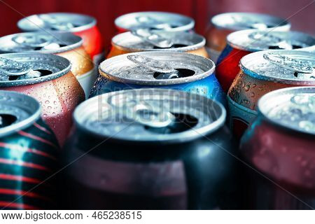 Beer Cans. Aluminum Cans. Close-up Of Lots Of Colorful Empty Cans With Drops Of Condensation. Recycl
