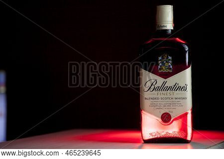 Ballantines Whiskey Bottle With Colorful Lights Background In Bar. Ballantines Concept. Whiskey Conc