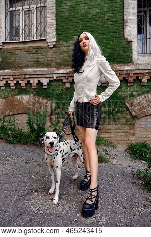 Cosplay On Cruella De Vil With A Dalmatian