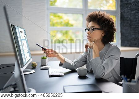 E Invoice Business Management. African Accountant Using Electronic Invoice