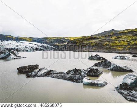 Icelandic Glacier Lagoon Bay With Icebergs Flowing Into The Sea