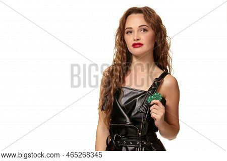 Casino Concept. Portrait Of Young Pretty Caucasian Woman, Playing In Casino. Roulette, Poker Chips, 