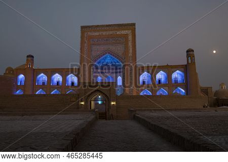 Khiva, Uzbekistan - September 07, 2022: Ancient Madrasah Of Allakuli Khan In Blue Night Illumination
