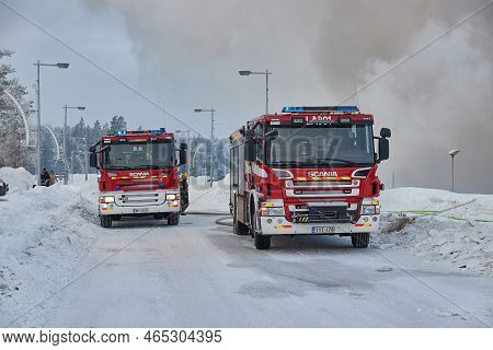 Saariselka, Finland - Circa 2022: Fire Trucks At A Burning Down Of Shopping Center Kuukkeli In Finni