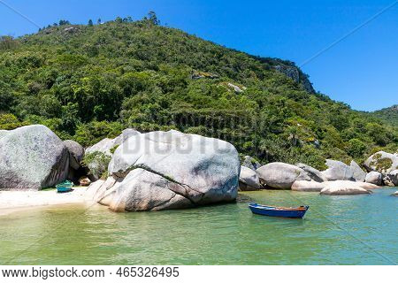 Fisherman Boat With Rocks And Forest