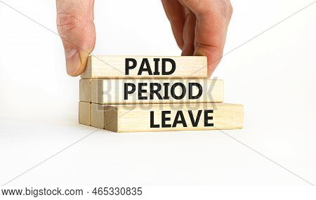 Paid Period Leave Symbol. Concept Words Paid Period Leave On Wooden Blocks. Beautiful White Table Wh