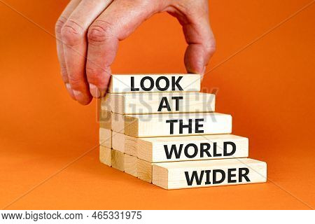 Look At The World Wider Symbol. Concept Words Look At The World Wider On Wooden Blocks On A Beautifu