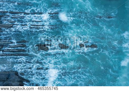 Aerial Drone Landscape Bird's Eye View Of Sunset Over Welcombe Mouth Beach In Devon England
