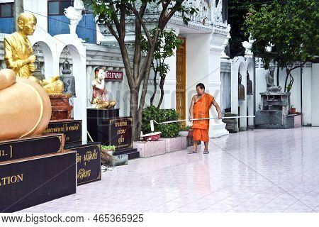 Bangkok, Thailand - December 2, 2006:  Monk Is Painting The Inner Walls Of Temple Wat Sitaram In Ban