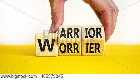 Be Warrior Not Worrier Symbol. Concept Words Warrior And Worrier On Wooden Cubes. Businessman Hand. 