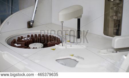 A Laboratory Biochemical Analyzer Analyzes Blood Serum Samples. The Automatic Machine Itself Mixes T
