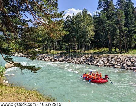 Arkhyz, Karachay-cherkessia, Russia - August 26, 2022: Tourists Go Rafting. View Of The Zelenchuk Ri