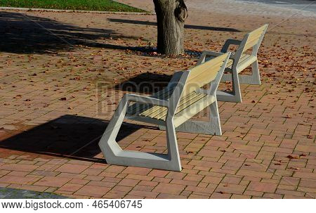 Light Concrete Park Bench, Elegant Cast Frame And Light Wooden Seat And Backrest Made Of Planks. Bro