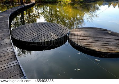 Floating Walkway Made Of Wooden Planks. Narrow Curved Paths On Stilts Driven Into The Bottom, Above 
