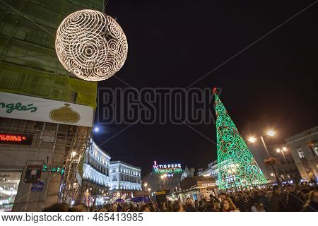 Madrid, Spain - December 22, 2010: People Have Fun In Christmas Time Passing The Famous Illuminated 